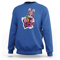 Royal blue crewneck sweatshirt with colorful bunny graphic on chest, long sleeves.