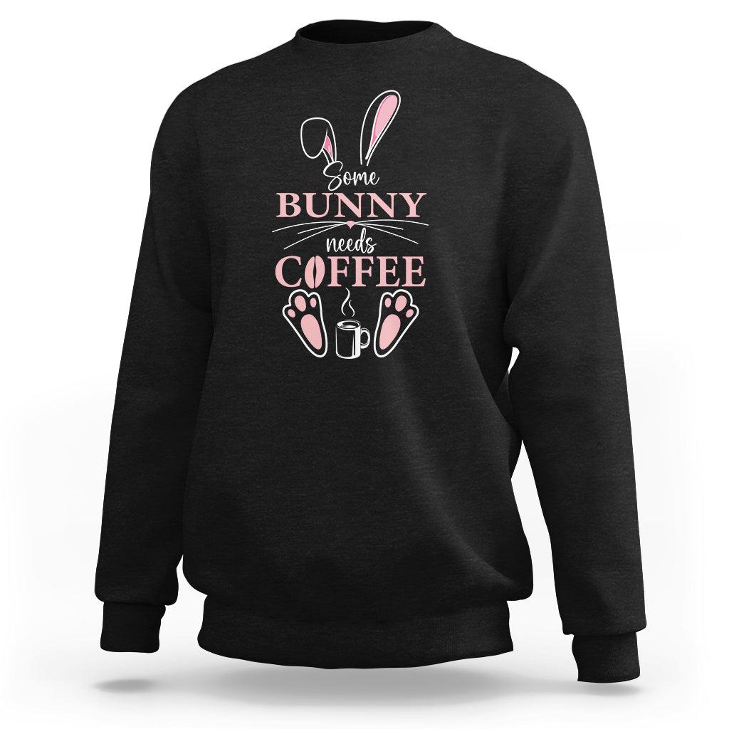 Black crewneck sweatshirt with “Some Bunny needs Coffee” bunny graphic on chest