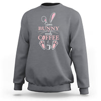 Charcoal gray crewneck sweatshirt with “Some Bunny needs Coffee” bunny graphic