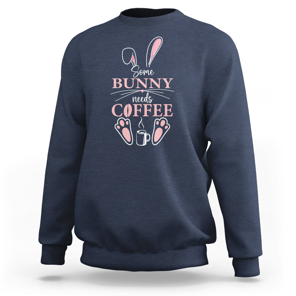 Navy crewneck sweatshirt with “Some Bunny needs Coffee” bunny graphic on chest