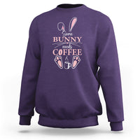 Purple crewneck sweatshirt with “Some Bunny needs Coffee” bunny graphic on chest