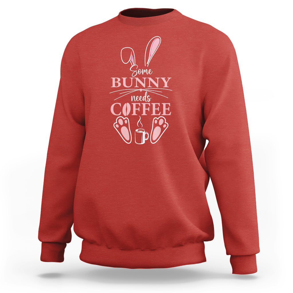 Red crewneck sweatshirt with “Some Bunny needs Coffee” bunny graphic on chest