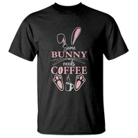 Black crewneck t-shirt with bunny 'needs coffee' graphic.