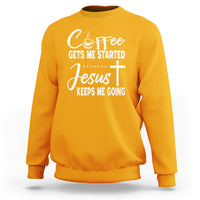 Gold sweatshirt with “Coffee Gets Me Started / Jesus Keeps Me Going” text graphic