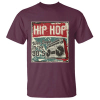 Maroon crewneck graphic T-shirt with “HIP HOP” 90s-style cassette and money design on front.