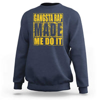 Navy crewneck sweatshirt with front graphic text 'GANGSTA RAP MADE ME DO IT'.