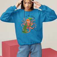 Light blue Christmas sweatshirt with colorful octopus holiday graphic centered on chest