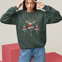 Dark forest green Christmas sweatshirt with skeleton dancer and ballerina graphic, long sleeves.