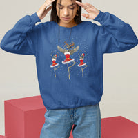 Royal blue Christmas sweatshirt with skeleton dancer and ballerina graphic, long sleeves.