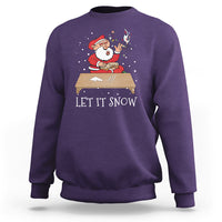 Purple crewneck Christmas sweatshirt with Santa graphic and 'LET IT SNOW' text