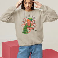 Light tan Christmas sweatshirt with a colorful octopus holiday graphic on the chest