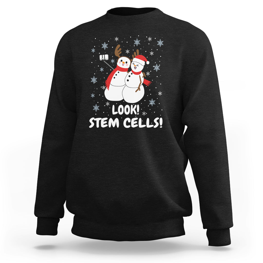 Black crewneck sweatshirt with snowman STEM graphic and 'LOOK! STEM CELLS!'