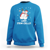 Sapphire blue crewneck sweatshirt with snowman STEM graphic and 'LOOK! STEM CELLS!'