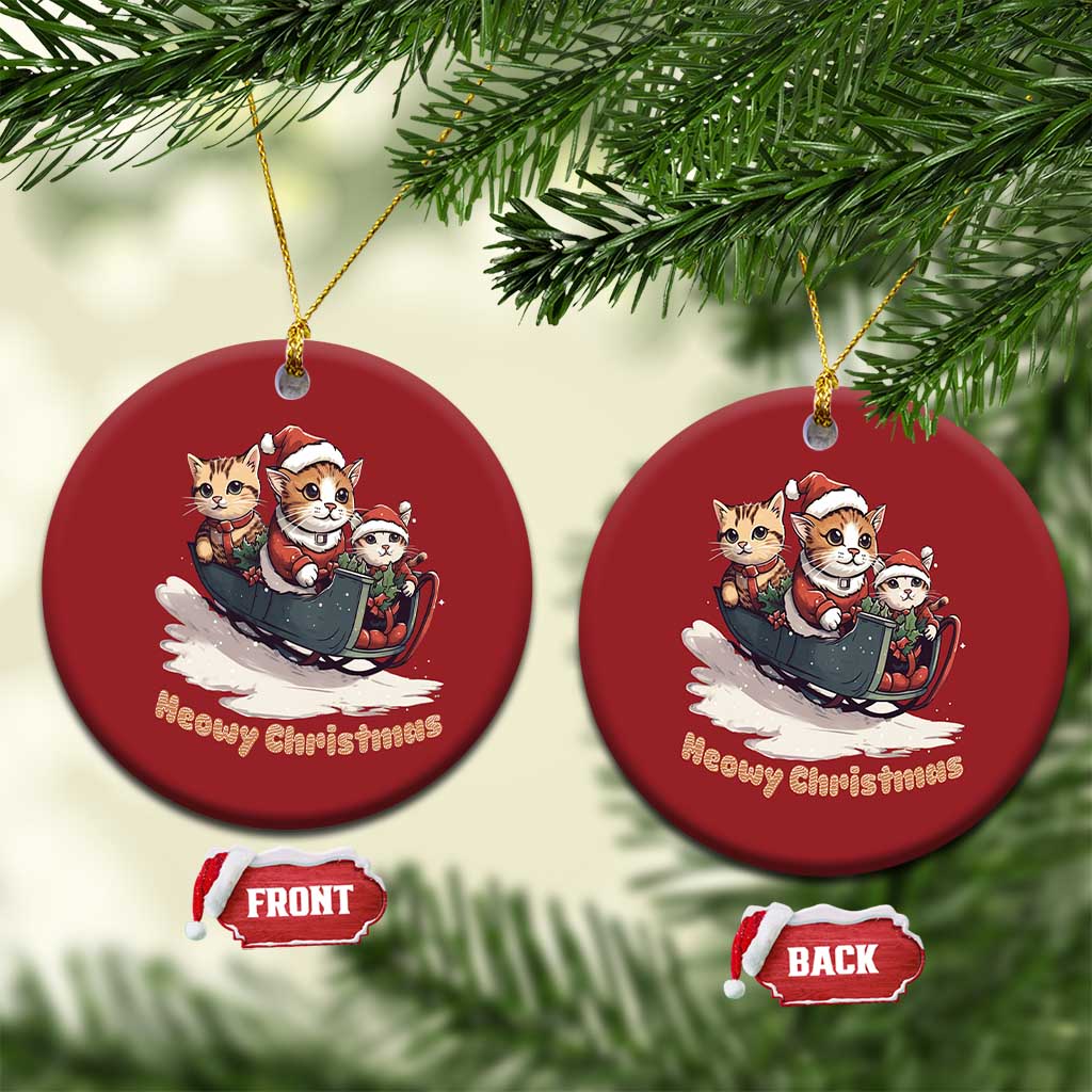 Set of red round Christmas cat sleigh ornaments with gold hangers and “Meowy Christmas” text.