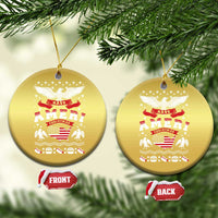 Pair of gold circle ornaments hanging on twine, with eagle and “Have Ameri Christmas” art