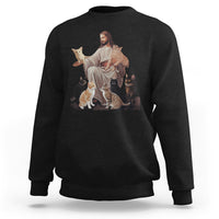 Black sweatshirt with front graphic of Jesus hugging cats