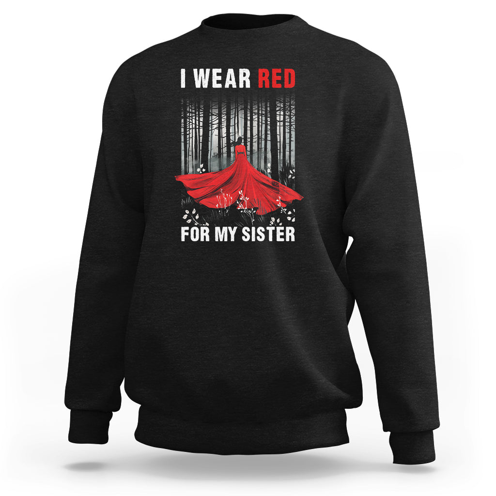 Black crewneck sweatshirt with red bird graphic and white text "I WEAR RED".