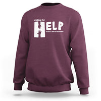 Purple sweatshirt with white “HELP” graphic and “Asking for” text on the chest