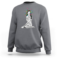 Gray crewneck sweatshirt with colorful “I AM” portrait graphic and motivational text