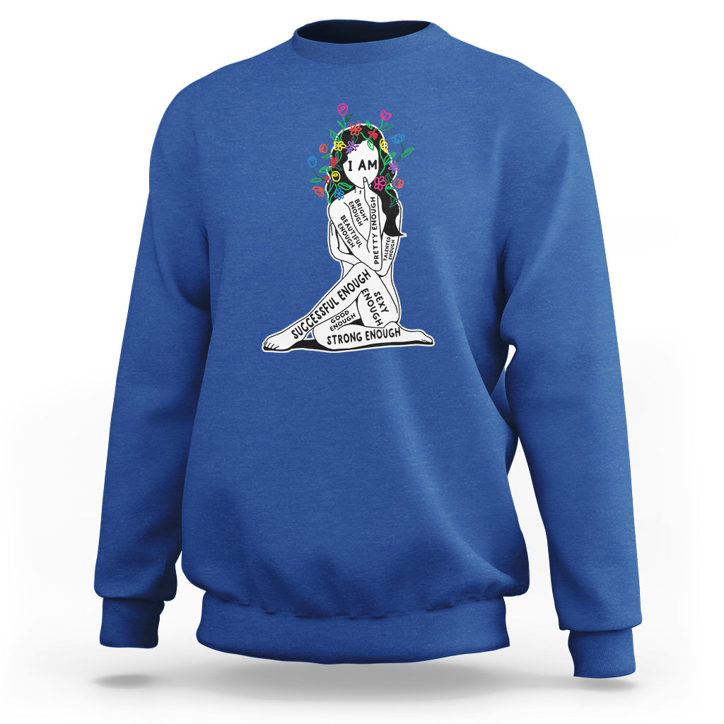 Royal blue crewneck sweatshirt with colorful “I AM” portrait graphic and motivational text