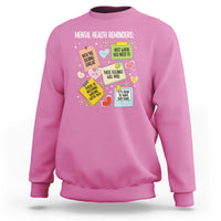 Pink crewneck sweatshirt with colorful mental health reminder quote graphic