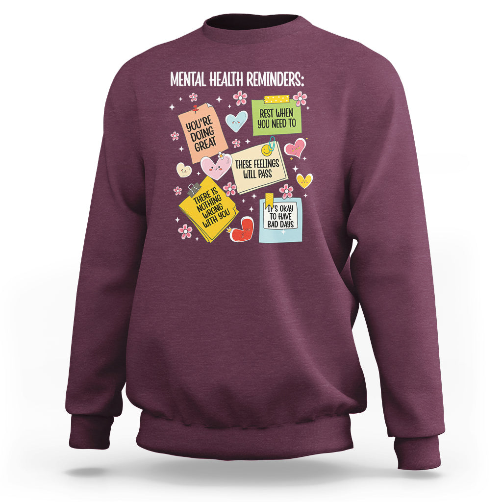 Maroon crewneck sweatshirt with colorful mental health reminder quote graphic
