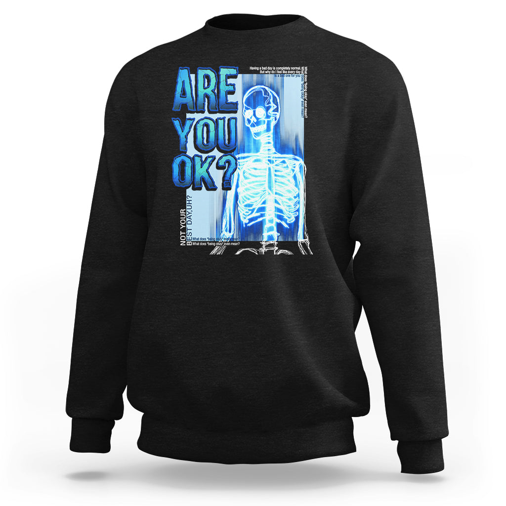Black crewneck sweatshirt with skeleton graphic and “Are you ok?” text on front
