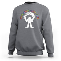 Charcoal gray crewneck sweatshirt with white graphic of figures and curved mental-health text
