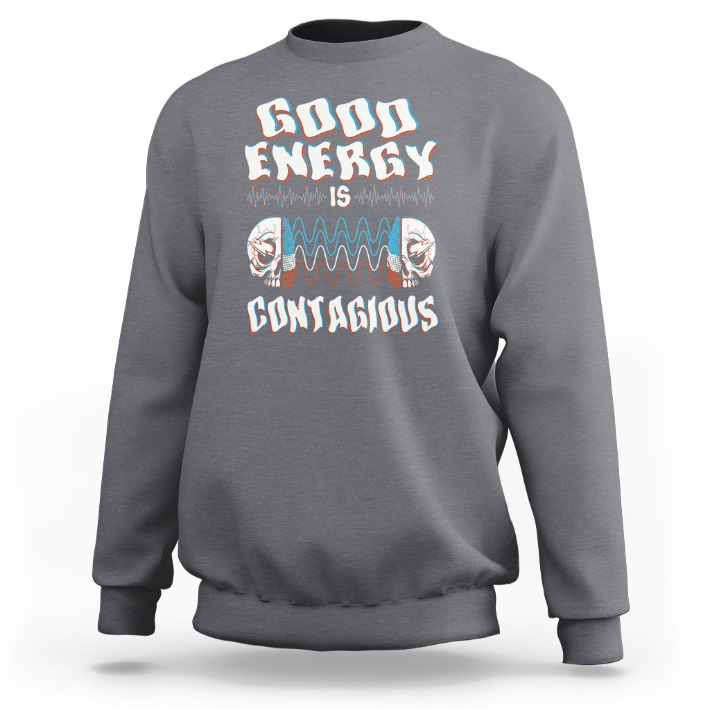 Charcoal gray crewneck sweatshirt with “Good Energy Is Contagious” skull graphic on chest