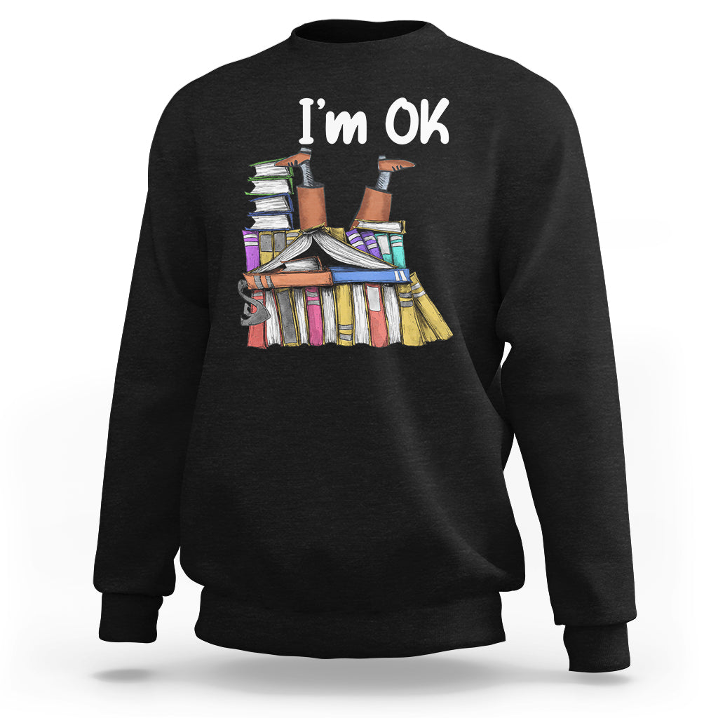 Black crewneck sweatshirt with "I'm OK" book stack graphic on front.