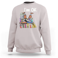 Light gray crewneck sweatshirt with "I'm OK" book stack graphic on front.