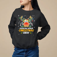 Kids crewneck sweatshirt in black with holiday nurse reindeer graphic
