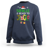 Navy crewneck Christmas sweatshirt with "Single & Ready to Jingle" graphic and jingle balls