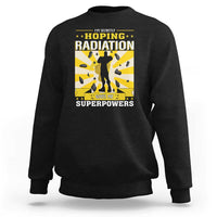 Black crewneck sweatshirt with long sleeves and radiation awareness front graphic.