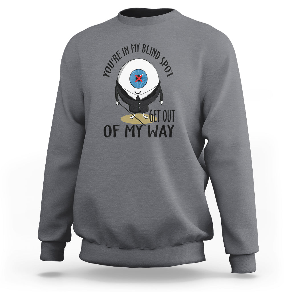 Charcoal gray crewneck sweatshirt with blind spot character graphic and “GET OUT OF MY WAY”