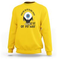 Yellow crewneck sweatshirt with blind spot character graphic and “GET OUT OF MY WAY” text
