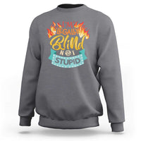 Charcoal crewneck sweatshirt with front graphic “I’m legally blind not stupid”