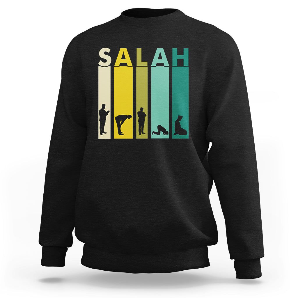 Black sweatshirt with 'SALAH' graphic print and prayer silhouette on the chest