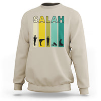 Sand beige sweatshirt with 'SALAH' graphic print and prayer silhouette on the chest