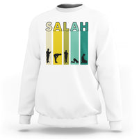 White sweatshirt with 'SALAH' graphic print and prayer silhouette on the chest
