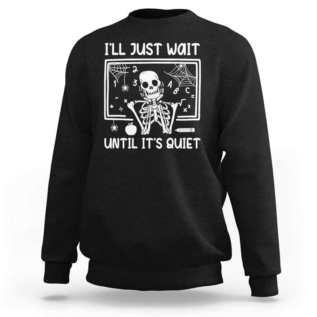 Black Halloween teacher sweatshirt with skeleton graphic and "I'll Just Wait" text