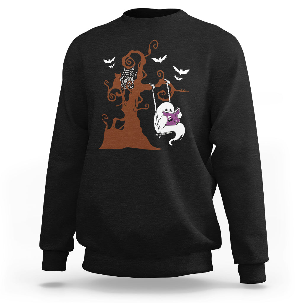 Black sweatshirt with orange Halloween tree and cute ghost reading book graphic.