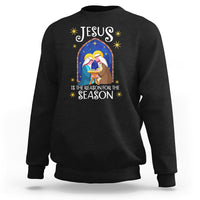 Black crewneck Christmas nativity sweatshirt with colorful Jesus message graphic
