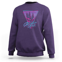 Adventure camping sweatshirt, purple, with neon triangle tree graphic.