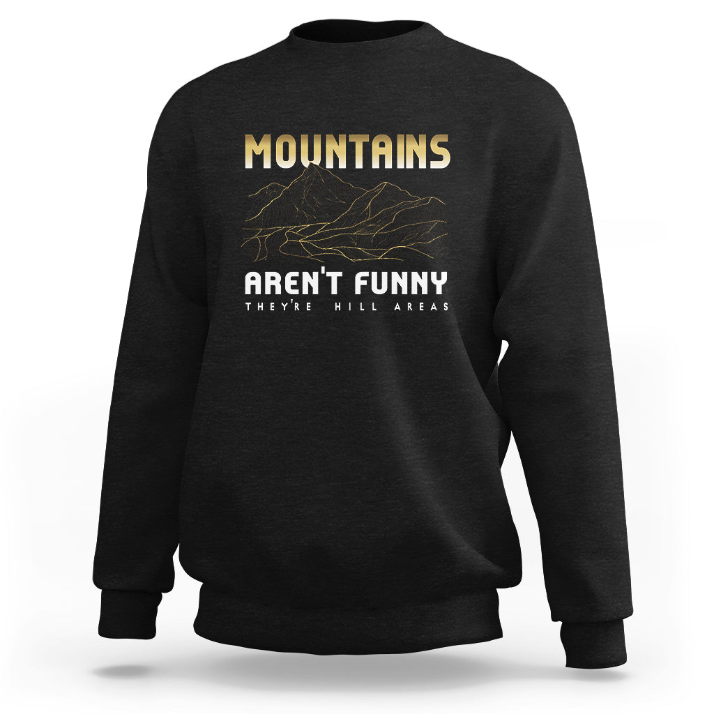 Black crewneck sweatshirt with yellow “MOUNTAINS” graphic and mountain line art