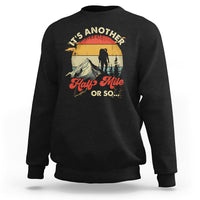 Black crewneck sweatshirt with hiking climber graphic on the front