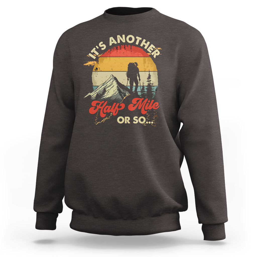 Charcoal crewneck sweatshirt with hiking climber graphic on the front