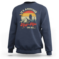 Navy crewneck sweatshirt with hiking climber graphic on the front