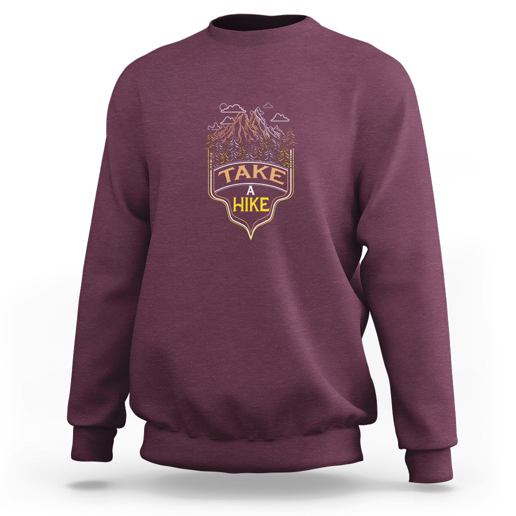 Maroon hiking sweatshirt with chest graphic and crew neck