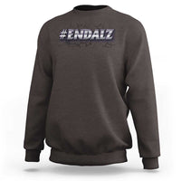 Dark brown crewneck sweatshirt with #ENDALZ graphic on chest; long sleeves and ribbed cuffs
